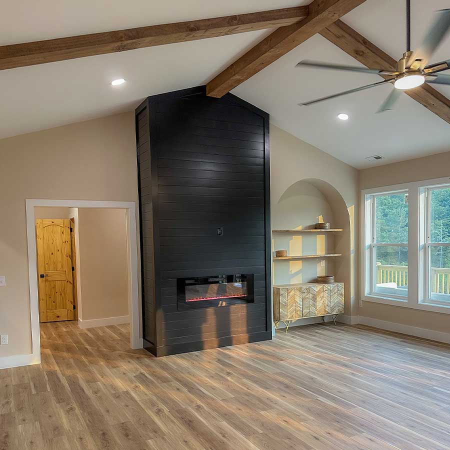Cozy fireplaces open living room in new custom home