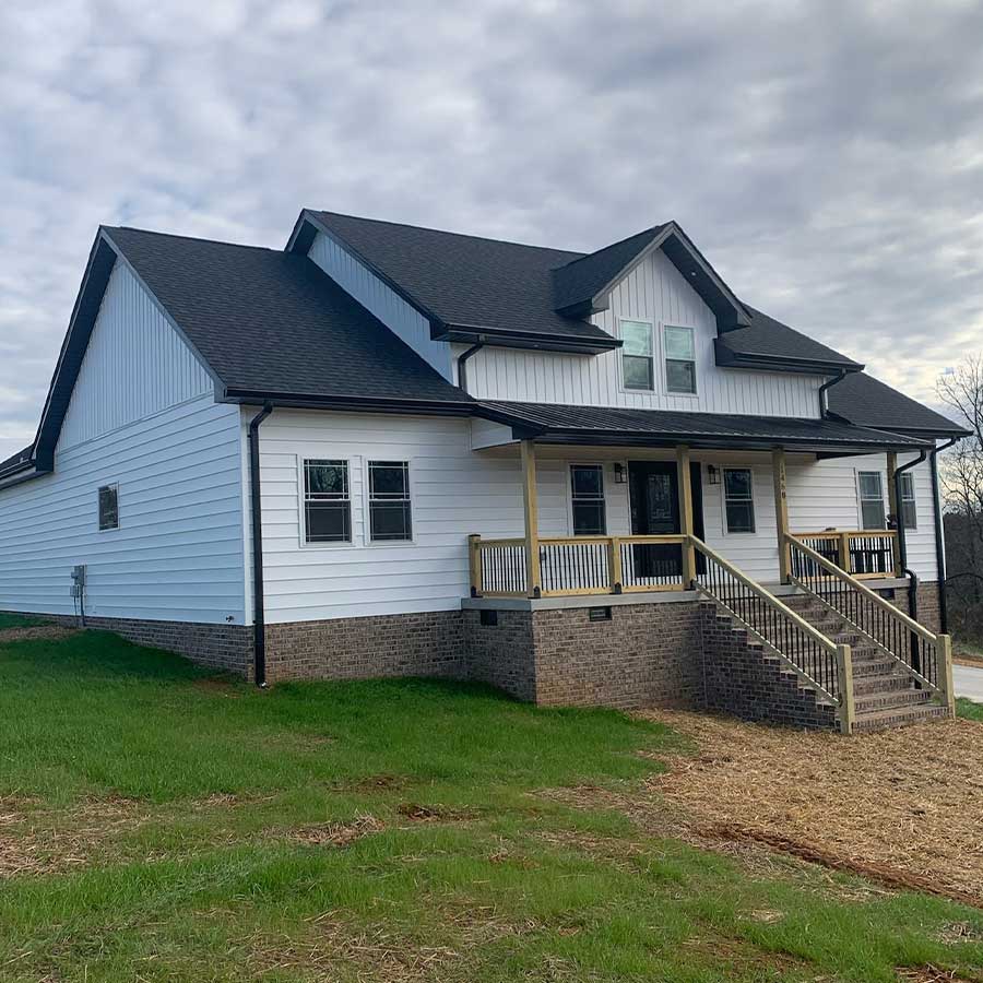 Beautiful home exterior and front porch designed and built by Dylan Bauguess Construction